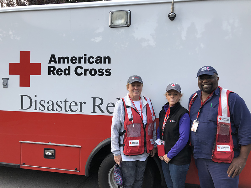 Three Red Cross volunteers